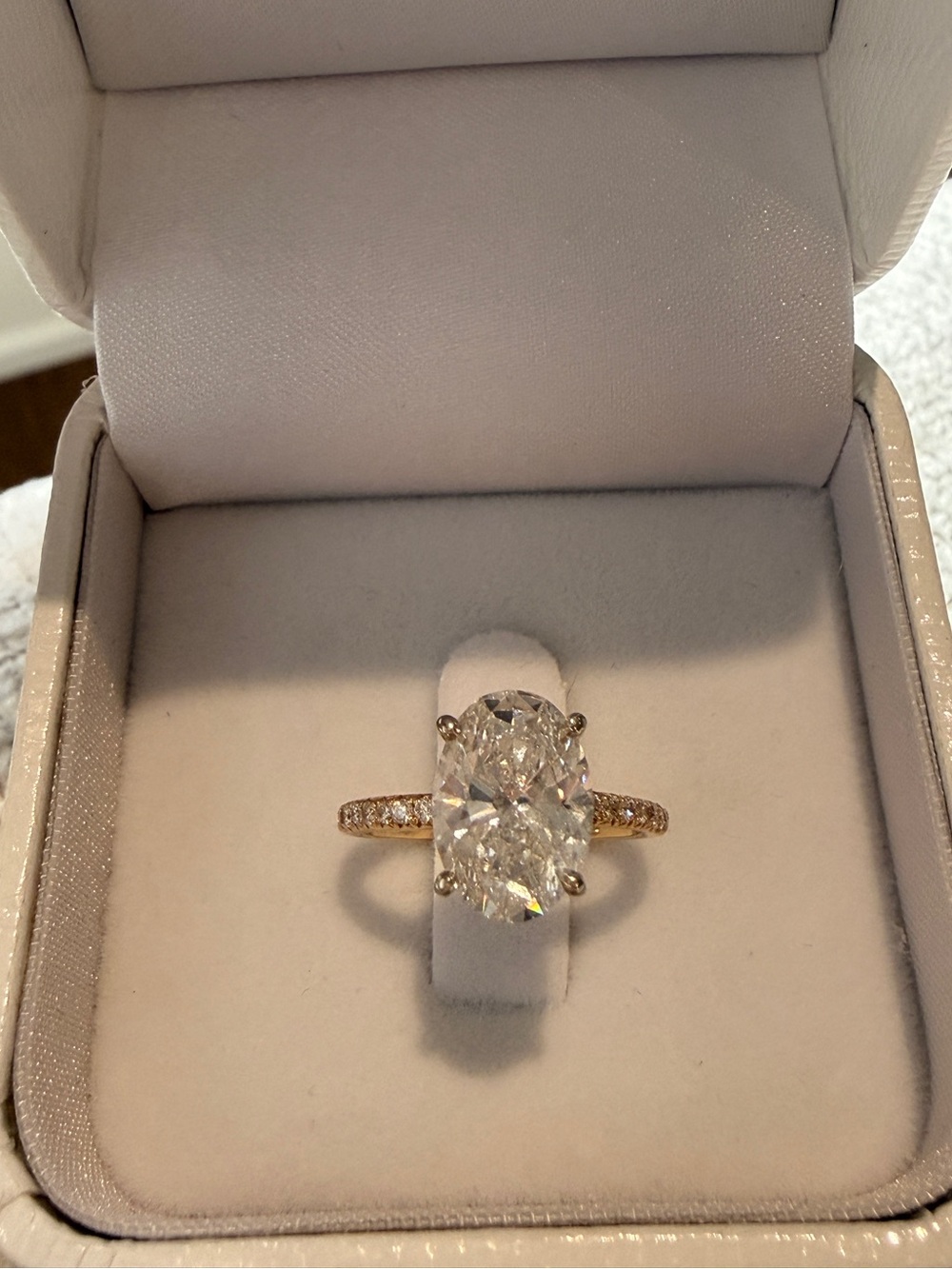Oval-Cut Solitaire Ring with Pavé Band in Yellow Gold
